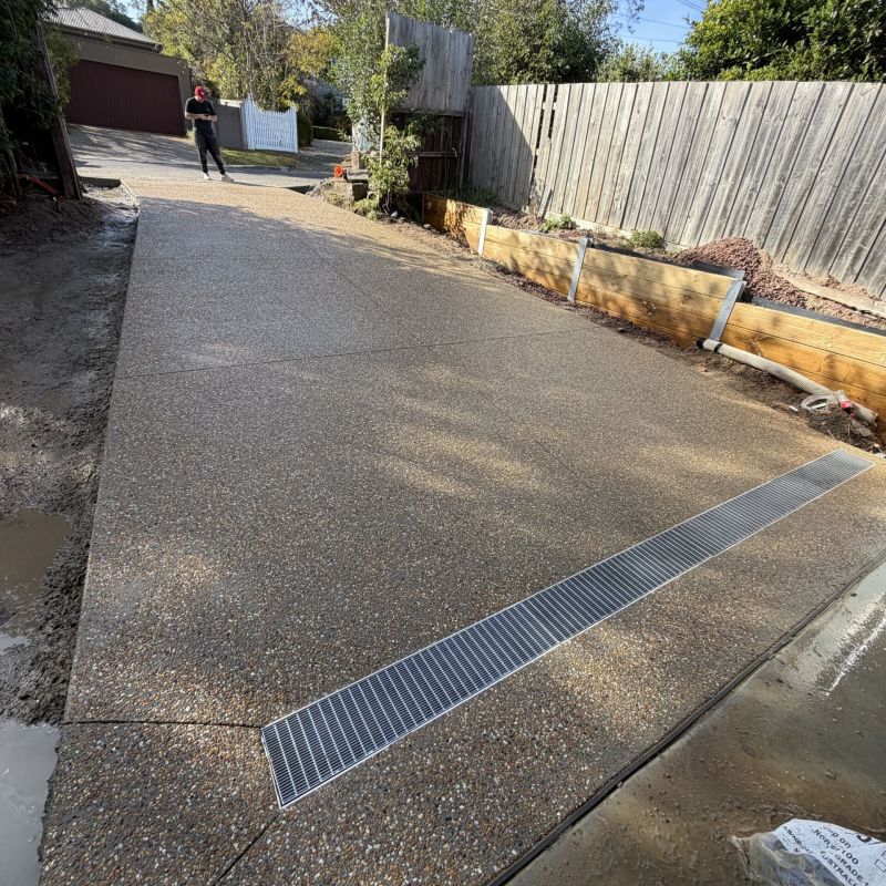 Greycon Group - a stunning exposed aggregate driveway completed in mt eliza using metro mix concrete covering 65m2 costingg approx $12K